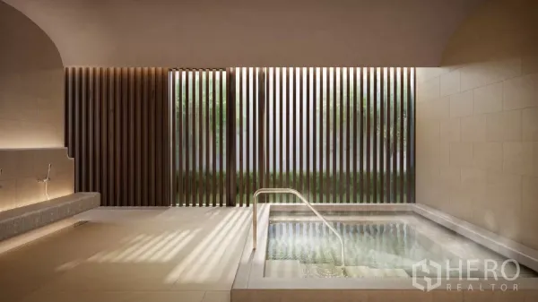 Apartment for rent in Khlong Toei, Bangkok - Indoor onsen-style hot tub with stone tiles and slatted wood screen allowing soft natural light.