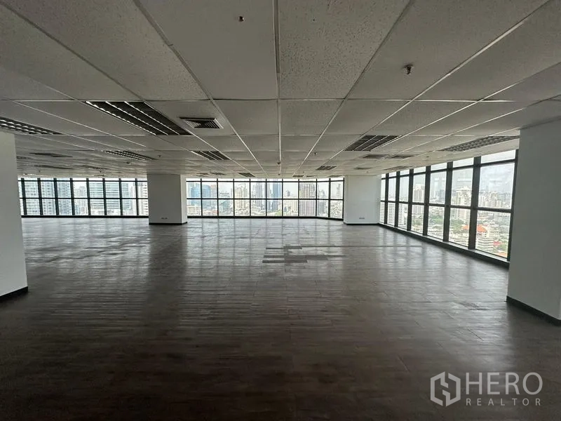 Office Space for rent - Open workspace with wide windows, abundant natural light and cityscape panorama.