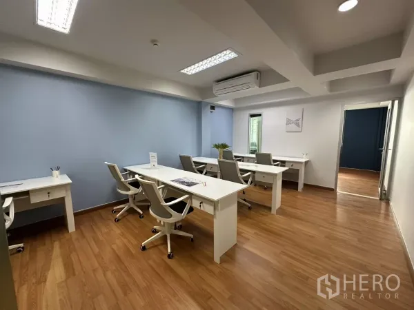 Office Space for rent in Watthana, Bangkok - Workstations in a bright furnished office with air conditioning, fluorescent lighting and laminate floors.