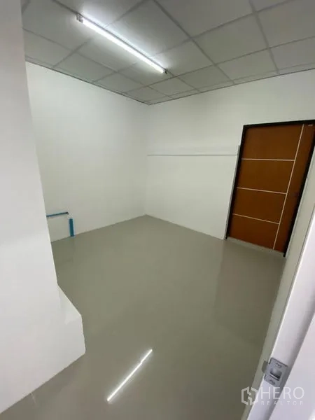 Office Space for rent in Chatuchak, Bangkok - Small private office or meeting room with glossy floor and wooden door.