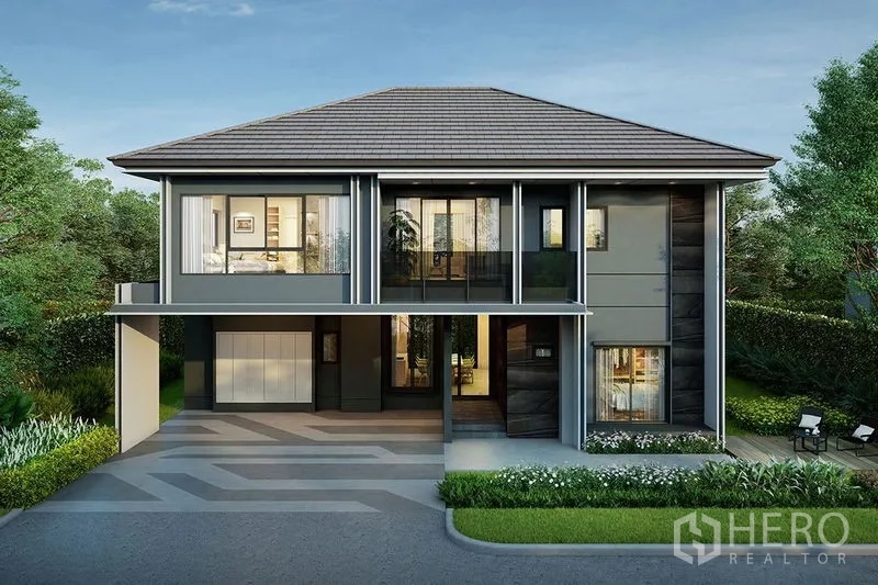 Detached House for sale in Bang Kapi, Bangkok - Modern two-storey detached house with full-height windows, balcony and covered three-car carport set amid landscaped garden in Bang Kapi.