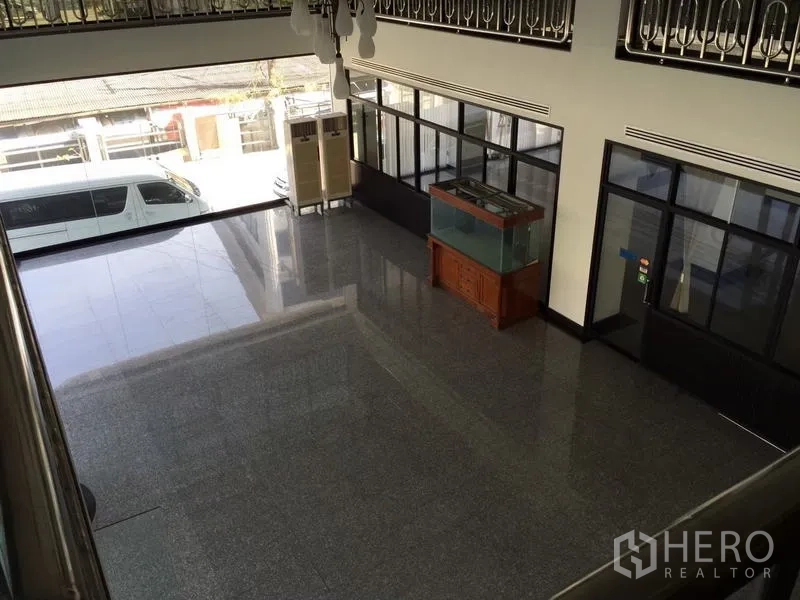 Standalone for rent in Bang Phli, Samut Prakan - Double-height lobby with polished floors, large front windows, and internal glass offices.