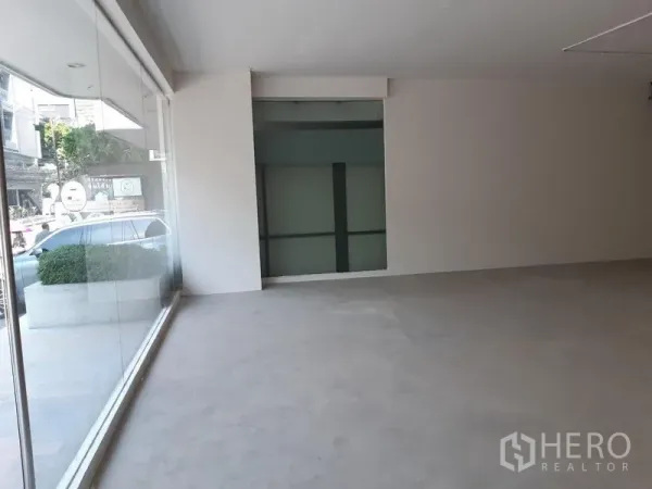 Retail Space for rent in Watthana, Bangkok - Street-facing shop space with floor-to-ceiling glass frontage and abundant natural light.