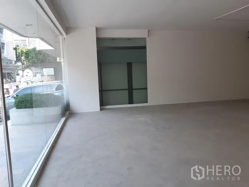 Retail Space for rent in Watthana, Bangkok - Street-facing shop space with floor-to-ceiling glass frontage and abundant natural light.