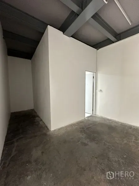 Office Space for rent in Khlong Toei, Bangkok - Unfurnished office area in Khlong Toei with white partition room, concrete floor and exposed steel ceiling beams.