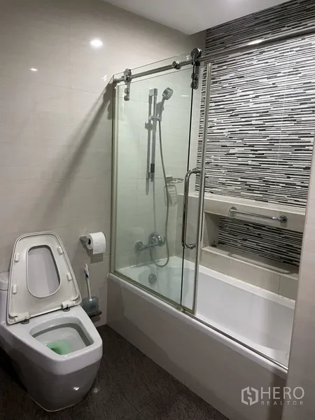 Home Office for rent or sale in Phra Khanong, Bangkok - Covered rooftop terrace with tiled floor, city skyline views and drying racks.