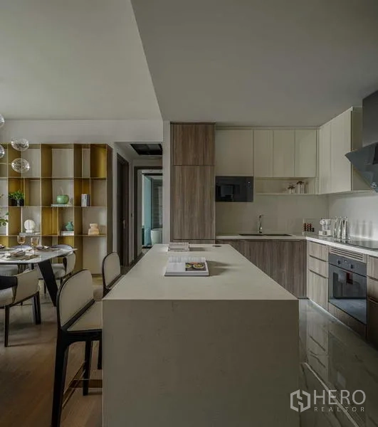 Condominium for rent - Open kitchen with a large island, built‑in appliances and adjacent dining area.