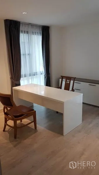 Detached House for rent in Prawet, Bangkok - Home office room with white desk, chairs, and storage cabinet.