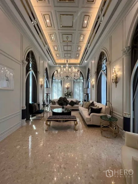 Detached House for rent or sale in Thawi Watthana, Bangkok - Elegant lounge with arched windows, coffered ceiling and crystal chandelier.