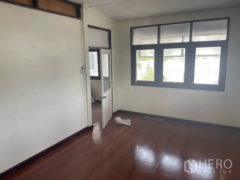 Detached House for rent in Suan Luang, Bangkok - Room with wide windows and an internal door opening to another space.