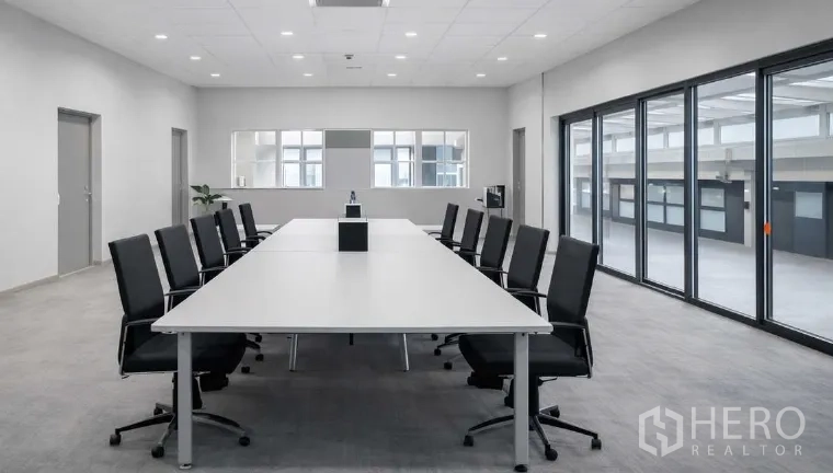 Factory for rent in Bang Pakong, Chachoengsao - Contemporary office and meeting room with long conference table, black chairs, and large windows.